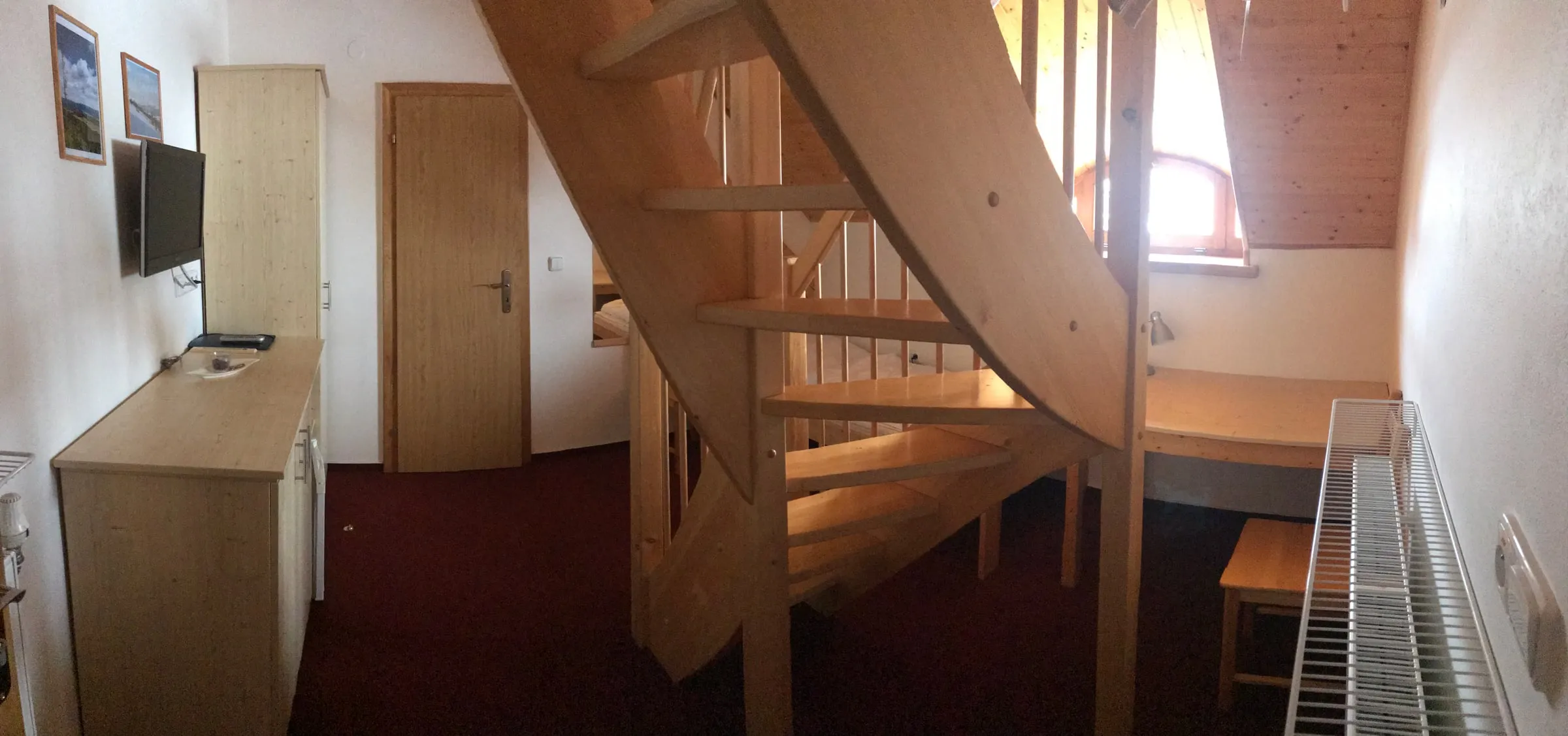 Wooden staircase in a two-level room